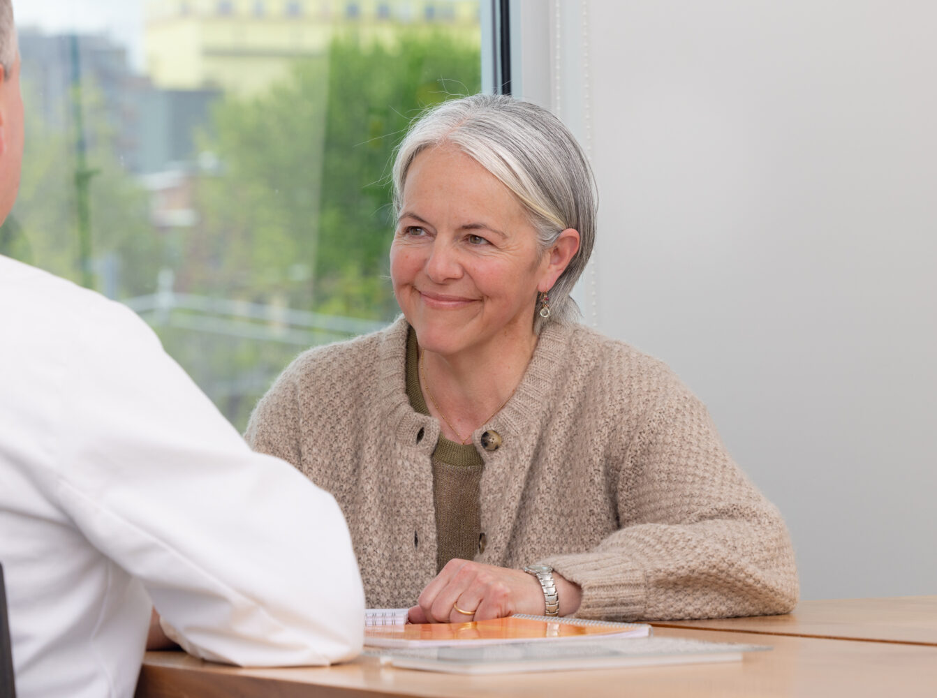 Executive coach Elena Jensen meets with a client