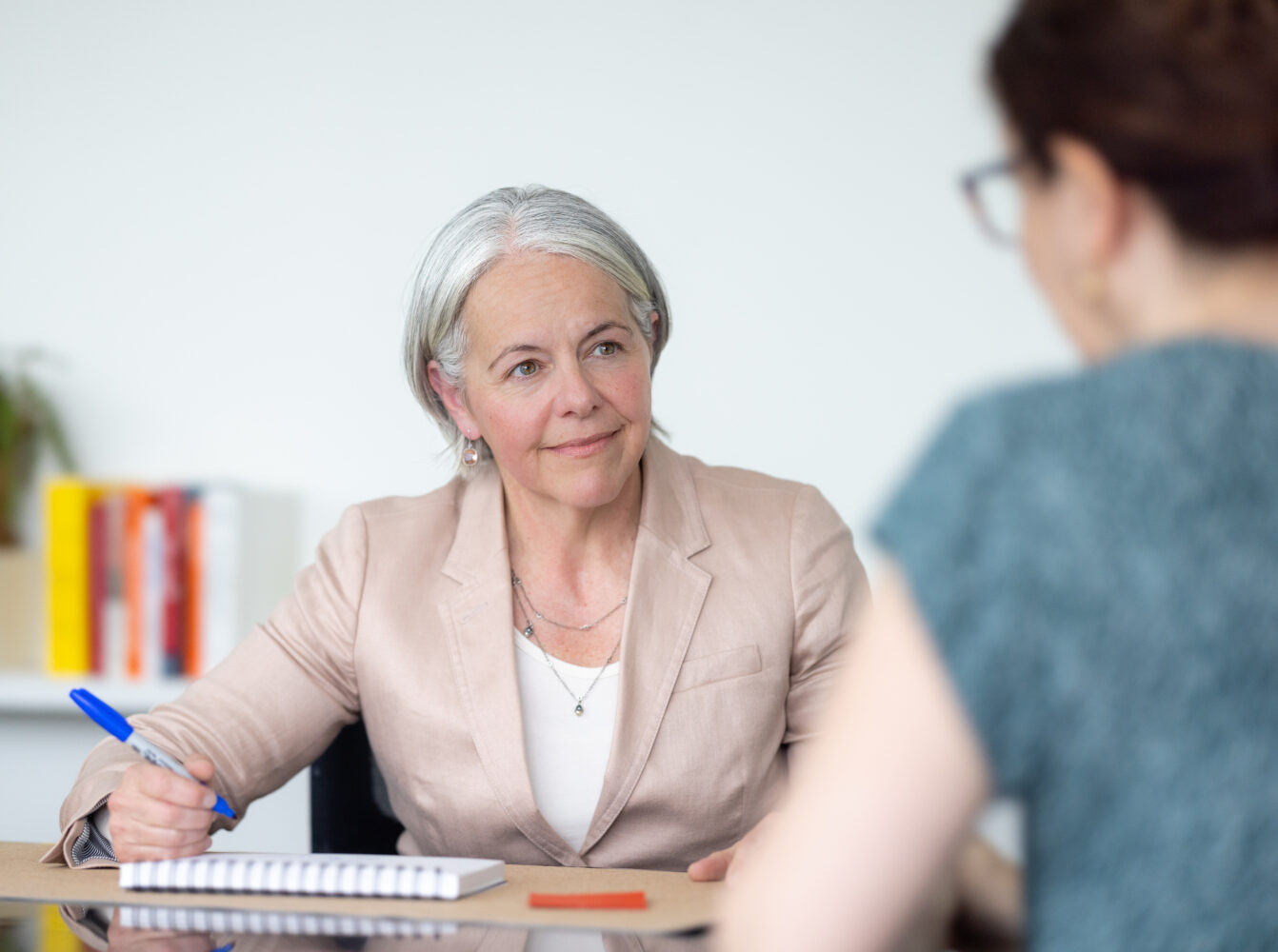 Executive coach Elena Jensen meets with a client